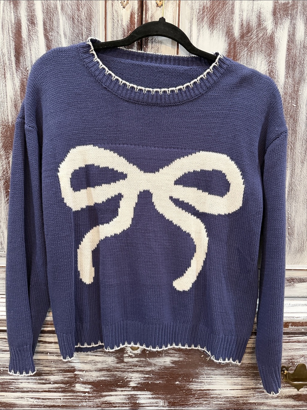 Navy Crewneck Sweater with Cream Bow Graphic